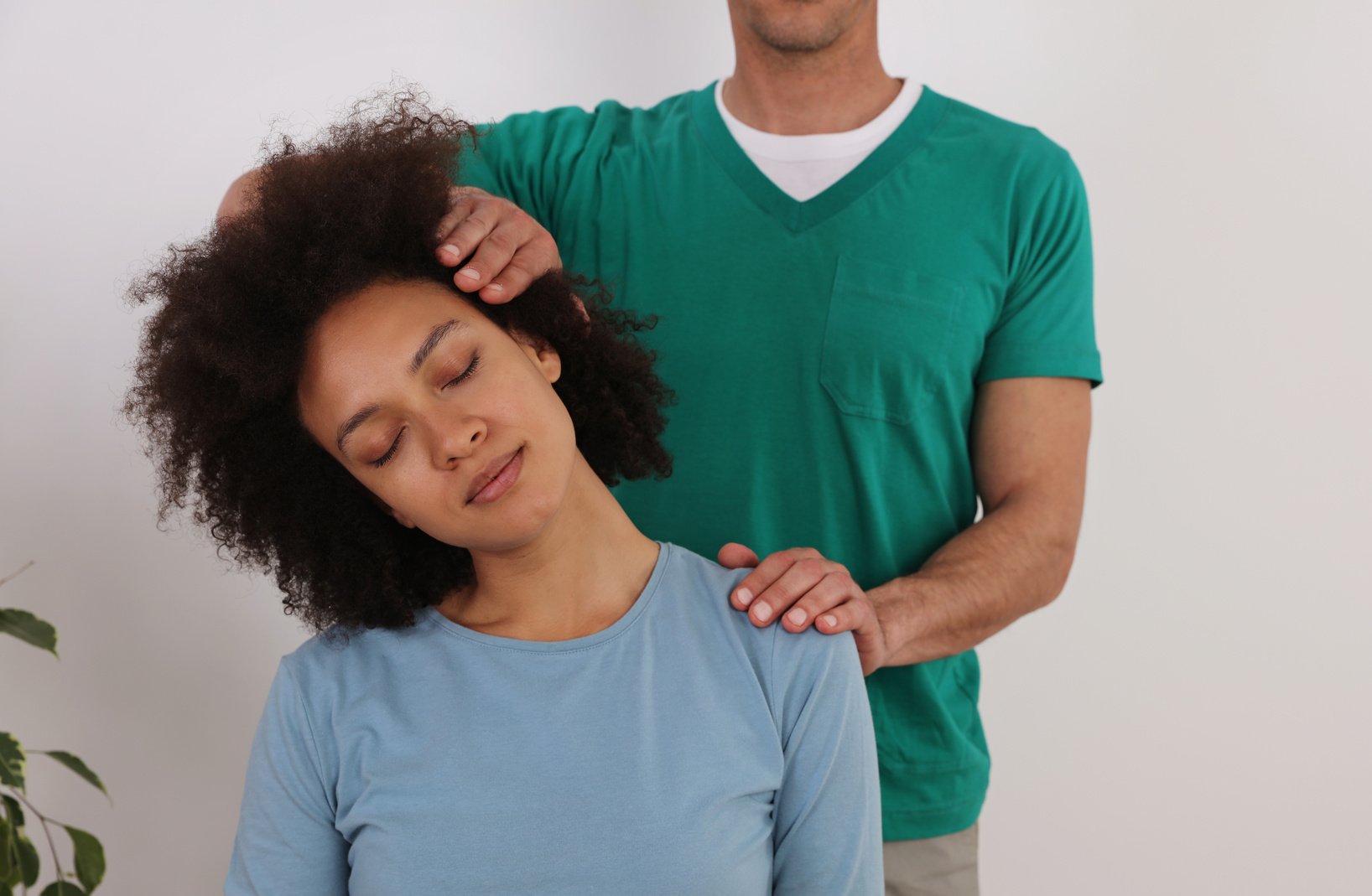 Woman having chiropractic back adjustment in rehabilitation clinic. Osteopathy, Physiotherapy concept